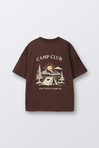 Brown kids' T-shirt with large back-to-front “CAMP CLUB” graphic and tent scene