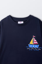 Navy kids' T-shirt with small sailboat and wave graphic at chest