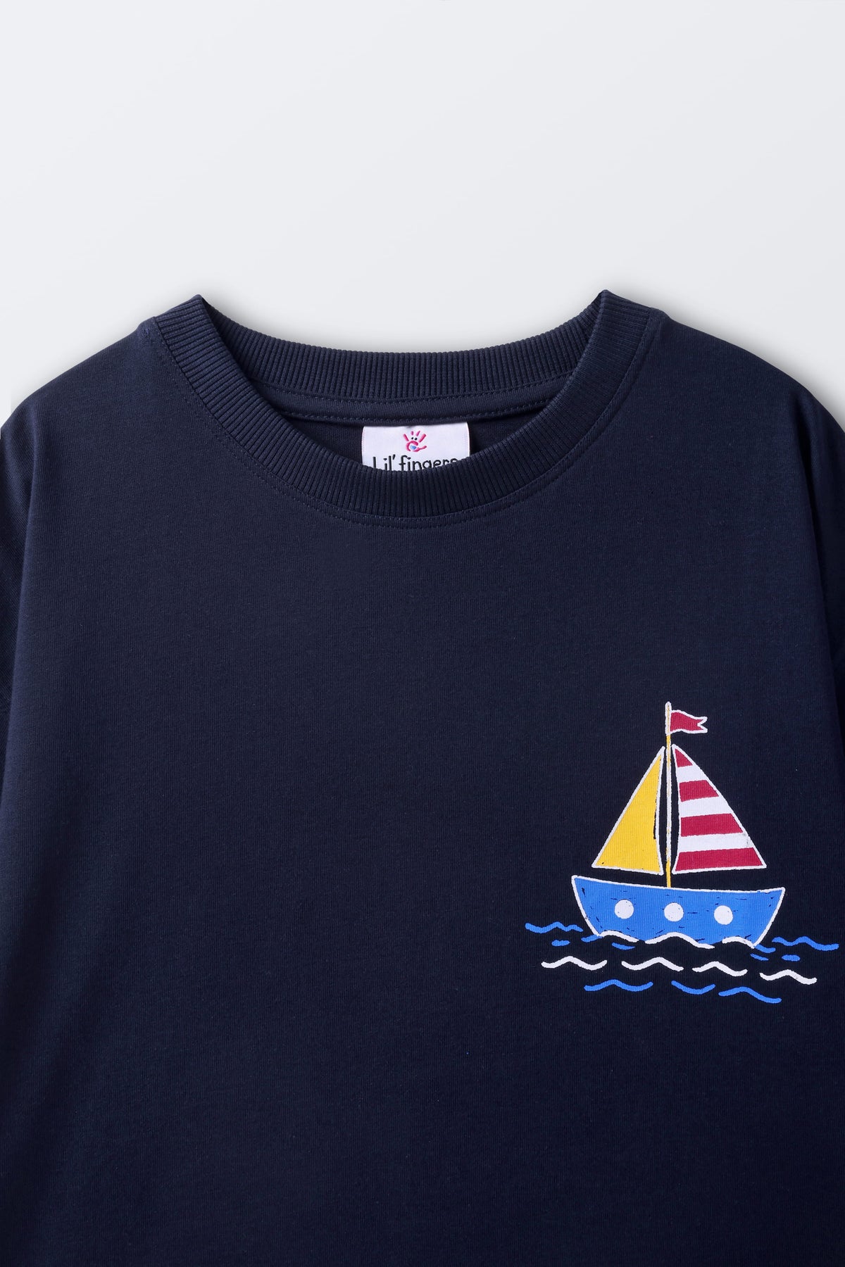 Navy kids' T-shirt with small sailboat and wave graphic at chest