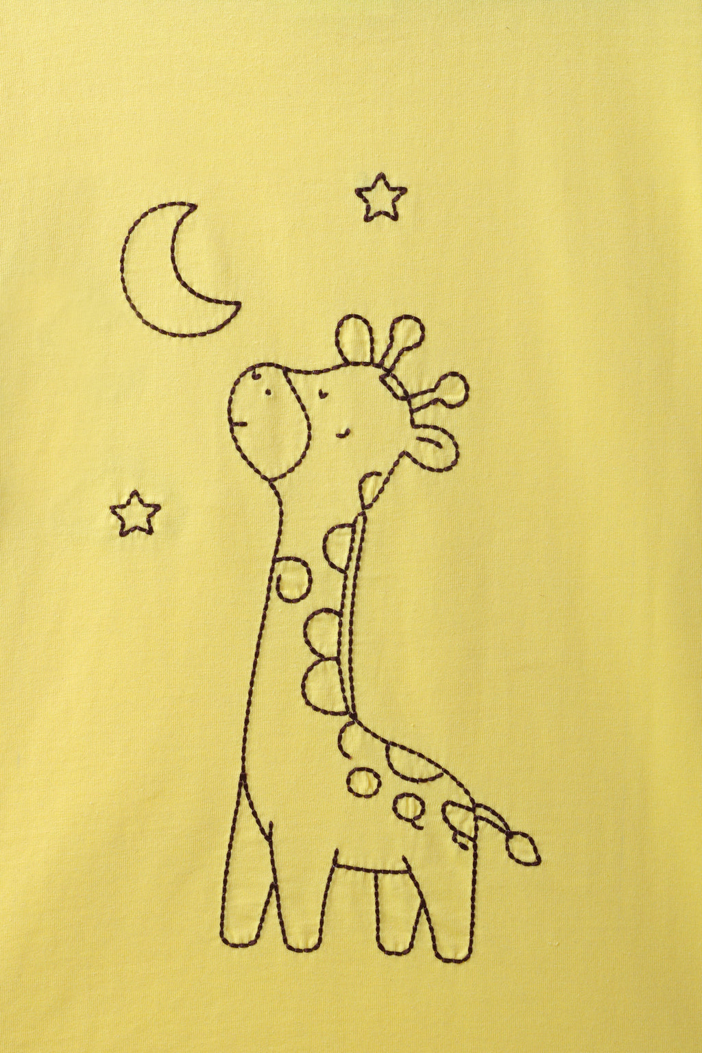 Yellow kids tee close-up of giraffe line-art with moon and star embroidery