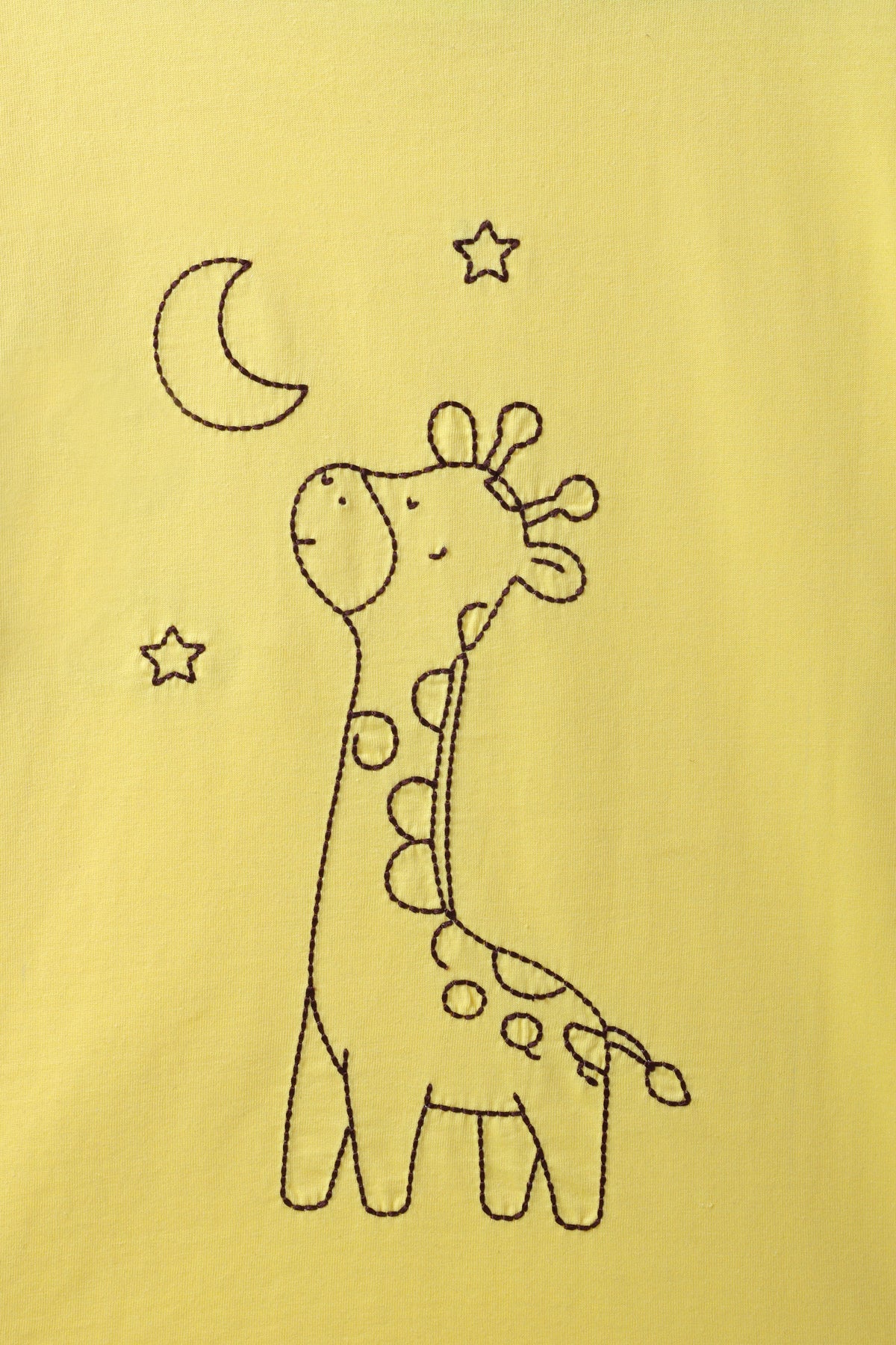 Yellow kids tee close-up of giraffe line-art with moon and star embroidery