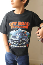 Black comfort tee with Off Road Exploring puff-print graphic worn by child