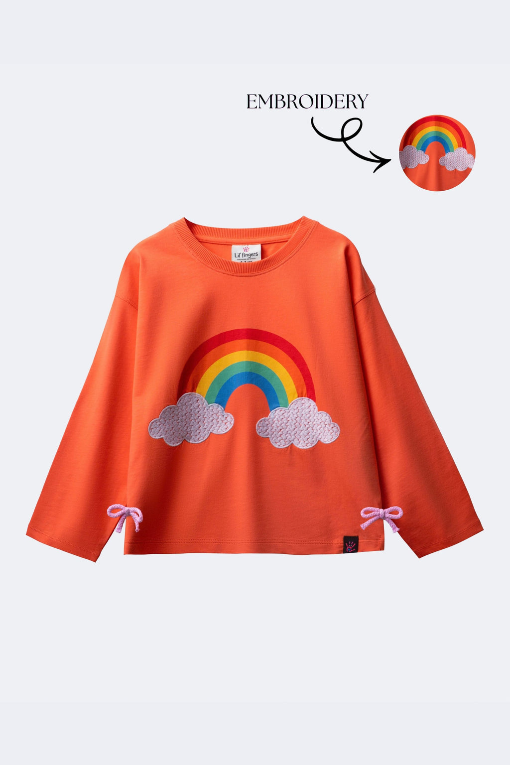 Girl’s coral long-sleeve T-shirt with rainbow and embroidered clouds, bow hem