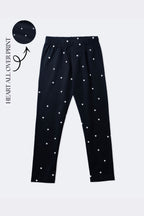 Black girls' stretch leggings with mini white heart all-over print and elastic waistband