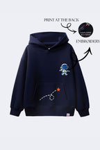 Navy hoodie with astronaut embroidery and rocket-dash graphic on chest