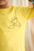 Yellow kids comfort tee close-up of giraffe and cloud stitched embroidery