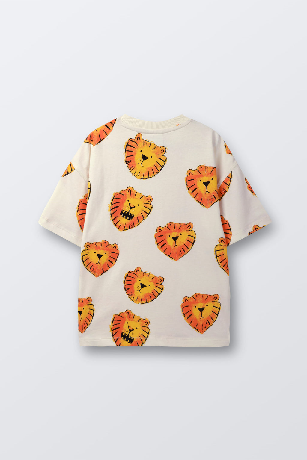 White t-shirt laid flat with orange lion face print pattern, angled view