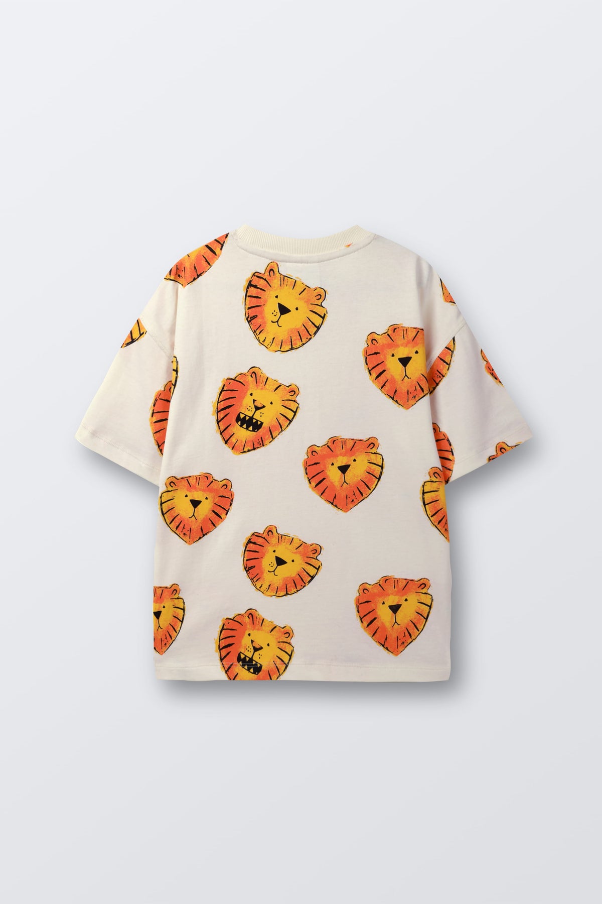 White t-shirt laid flat with orange lion face print pattern, angled view