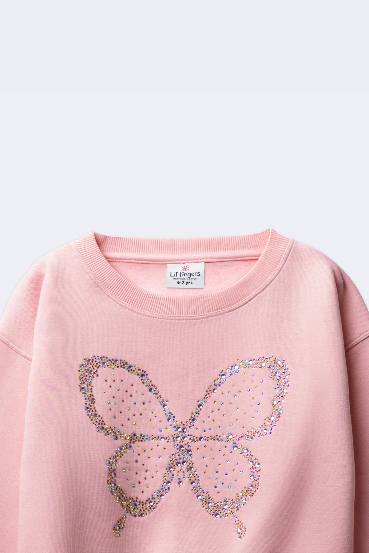 Girl's blush pink sweatshirt with sequined butterfly beadwork on the front
