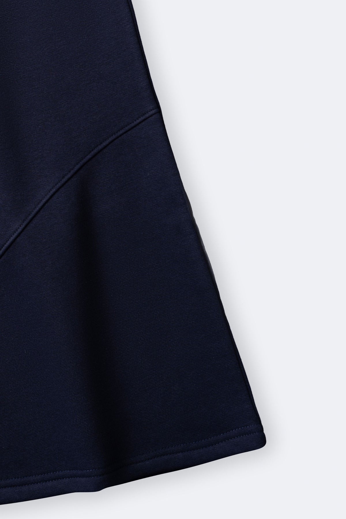 Navy fleece palazzo pant leg with smooth side seam and wide flare hem