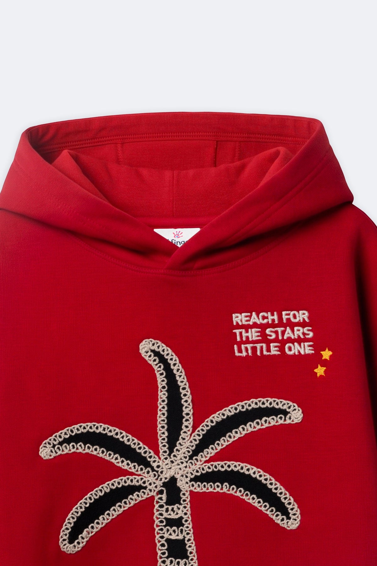 Red fleece hoodie with palm tree applique and starry quote on chest