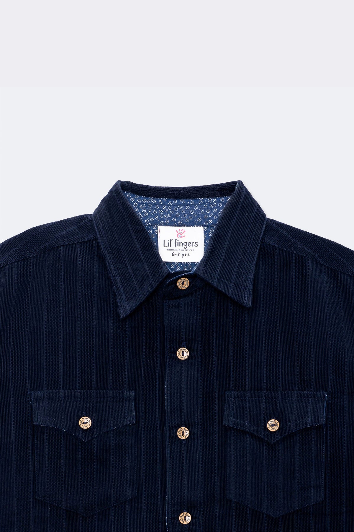 Boys navy corduroy button-up shirt with contrast inner collar and gold snap buttons