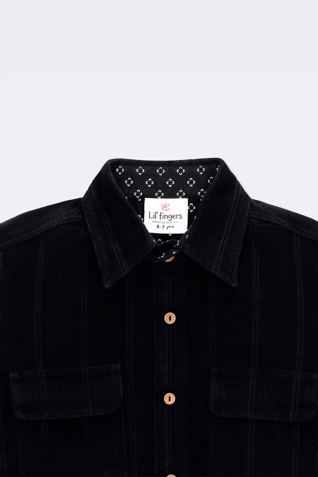 Black corduroy full-sleeve shirt, twin flap pockets and wooden-look buttons