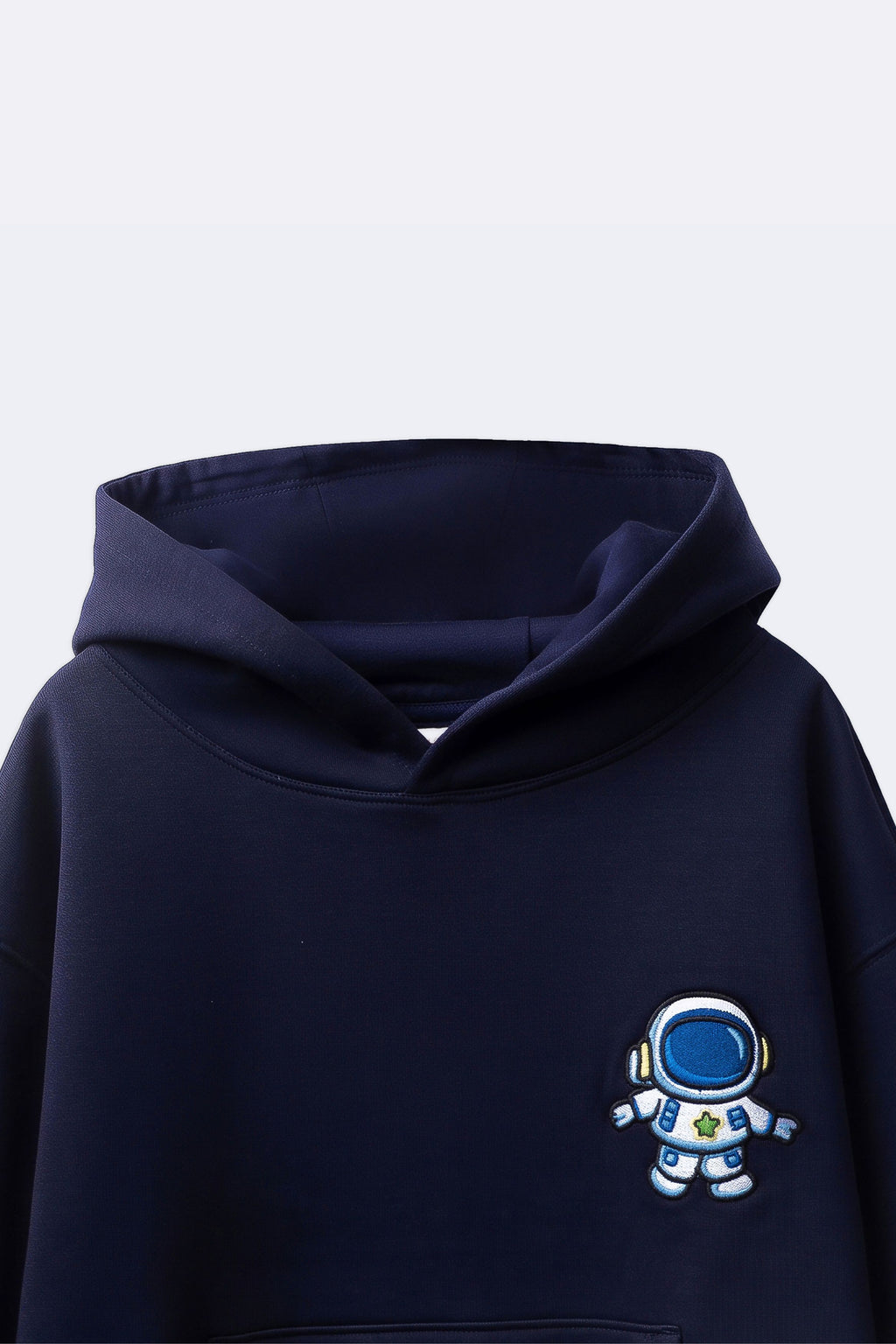 Navy hoodie close-up with blue astronaut embroidery on chest