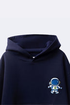 Navy hoodie close-up with blue astronaut embroidery on chest