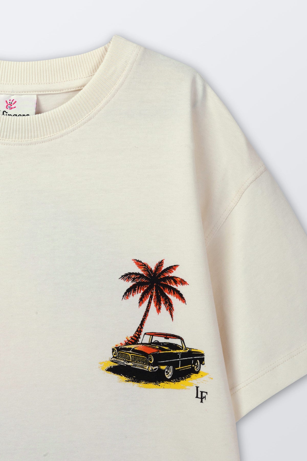 Cream T-shirt with palm tree beach car graphic on chest and small LF logo