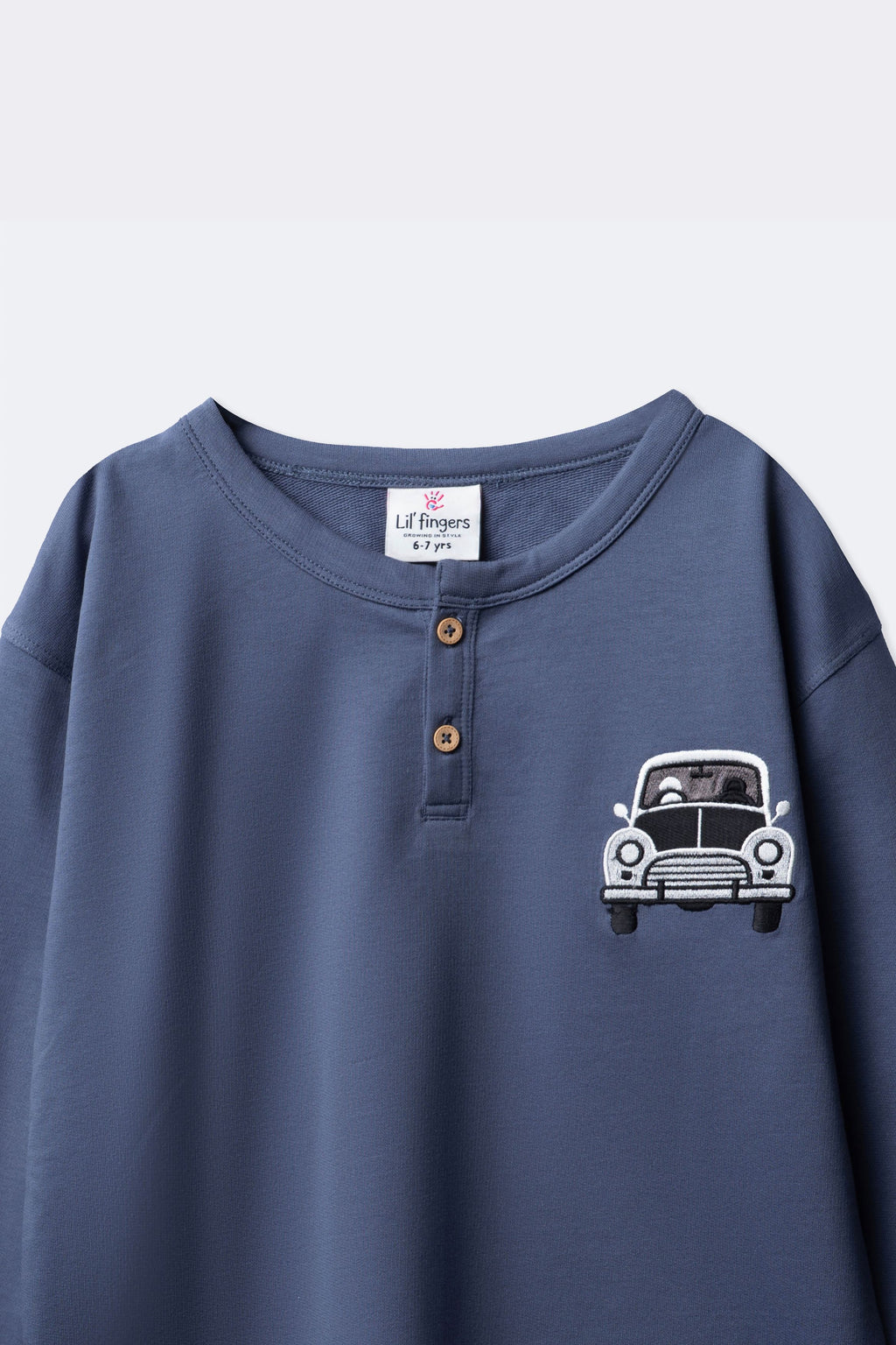 Boys denim blue terry henley with button placket and car embroidery detail