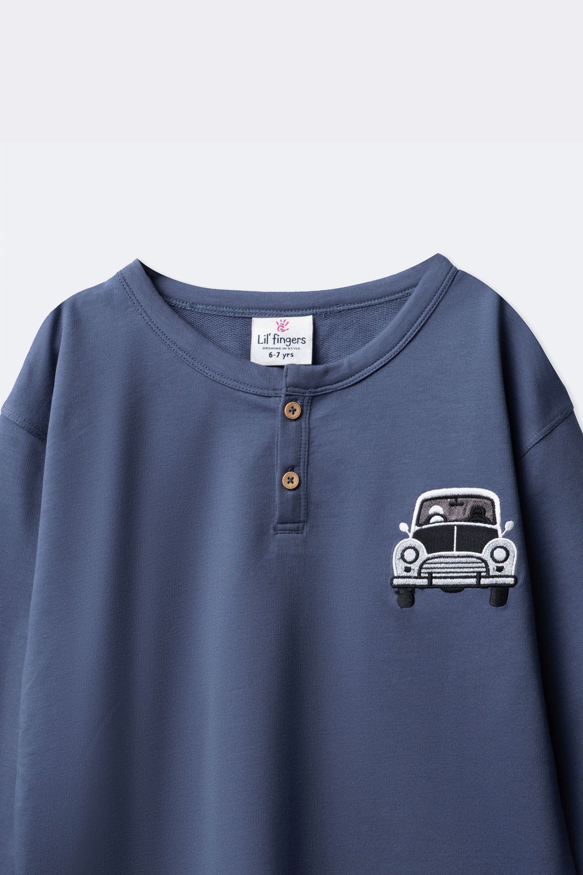 Boys denim blue terry henley with button placket and car embroidery detail