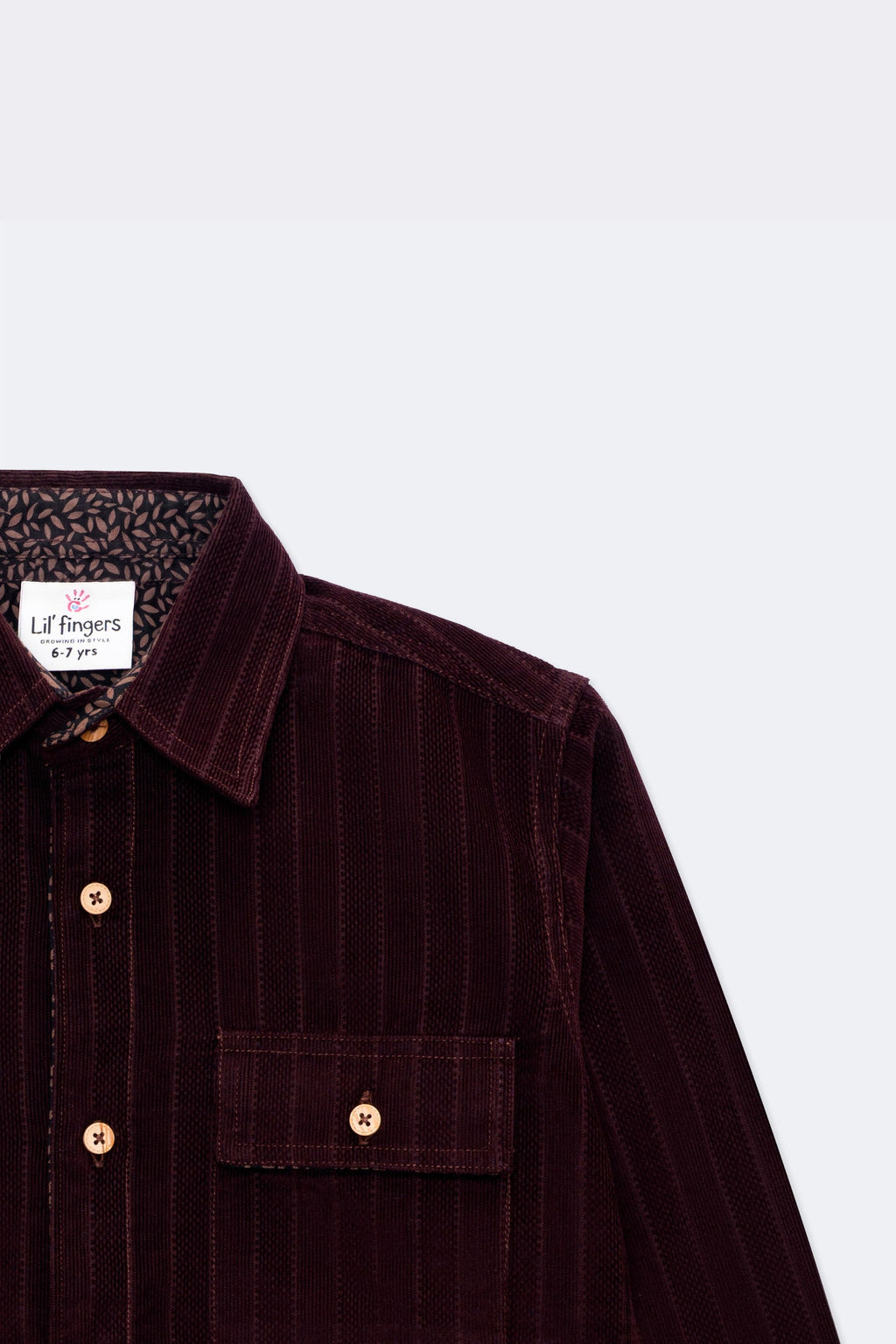 Burgundy corduroy button-up with contrast patterned cuff and chest patch pocket