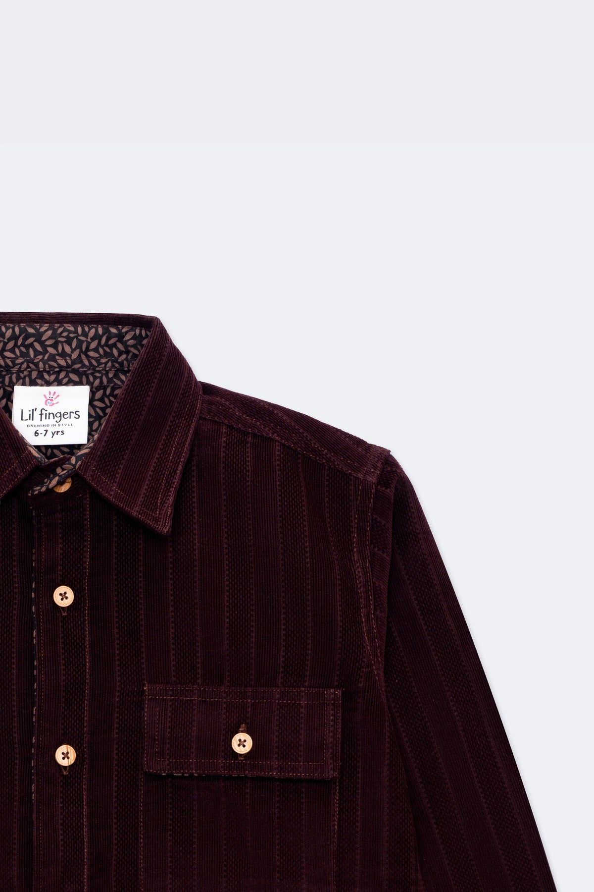 Burgundy corduroy button-up with contrast patterned cuff and chest patch pocket