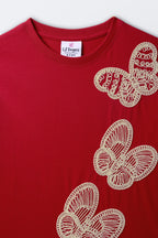 Red crewneck tee with white butterfly embroidery and ribbed collar