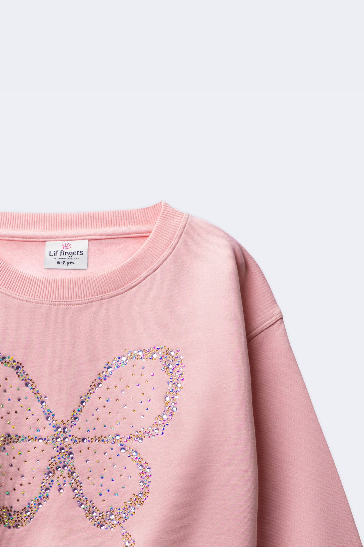 Girl's blush pink sweatshirt with glittering butterfly beadwork and round neckline