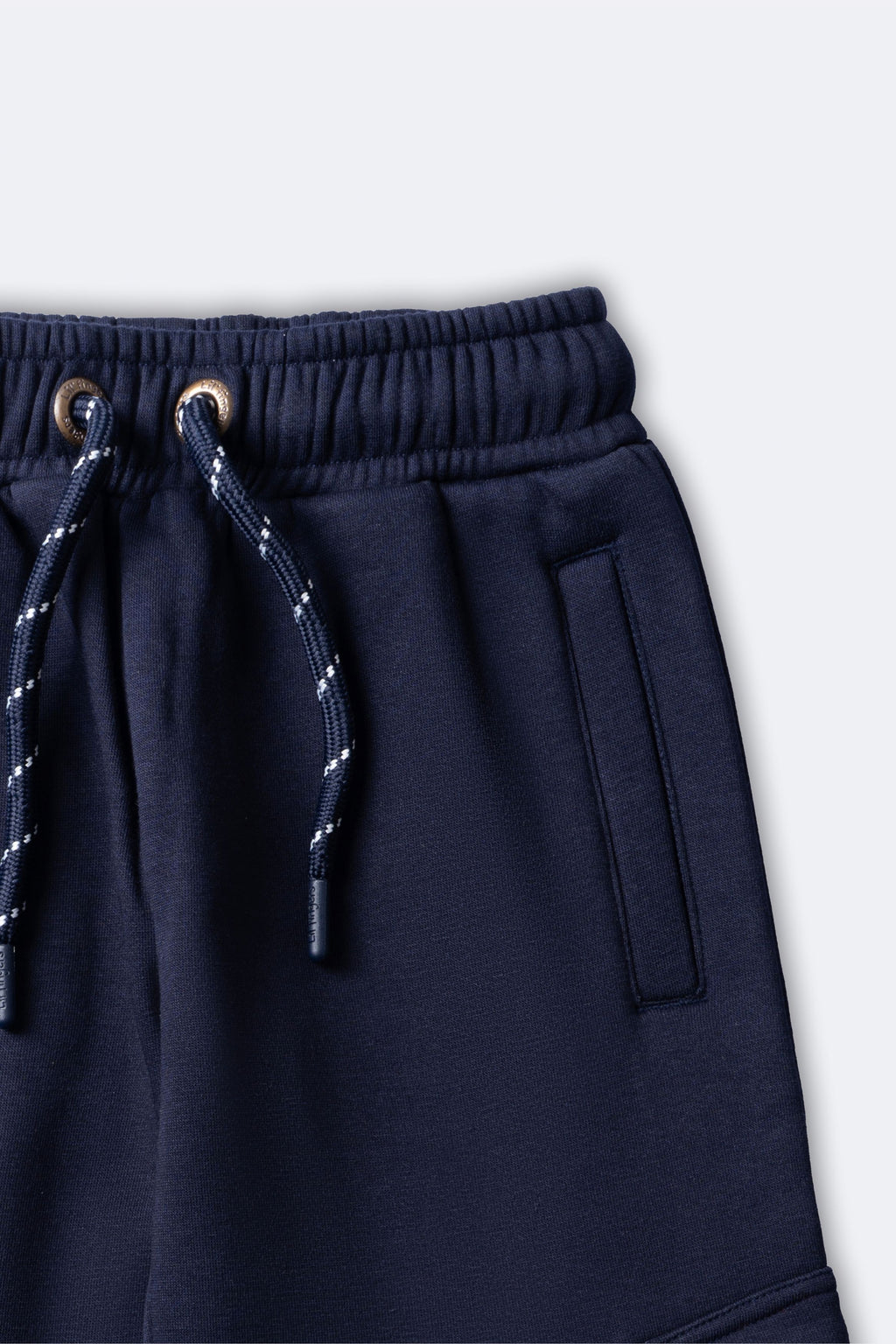 Navy fleece pajama pants with elastic waistband and drawstring with metal eyelets