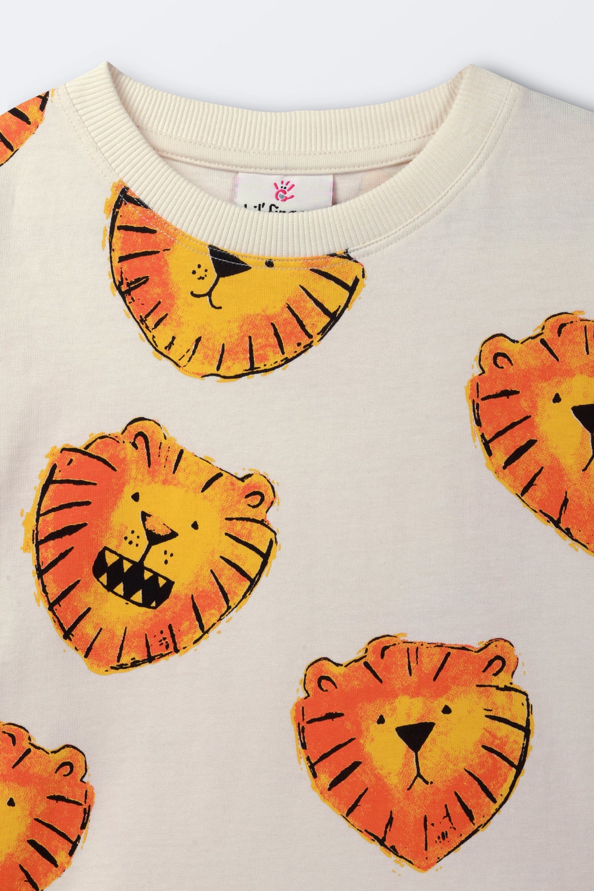 White t-shirt with scattered orange lion face print, neckline close-up
