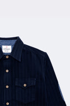 Boys navy corduroy button-up shirt with front flap pockets and contrast under-collar