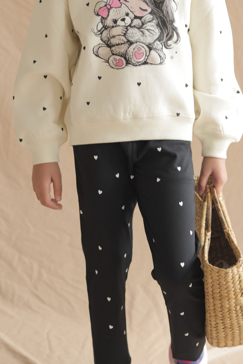 Black leggings with mini white hearts, elastic waistband detail