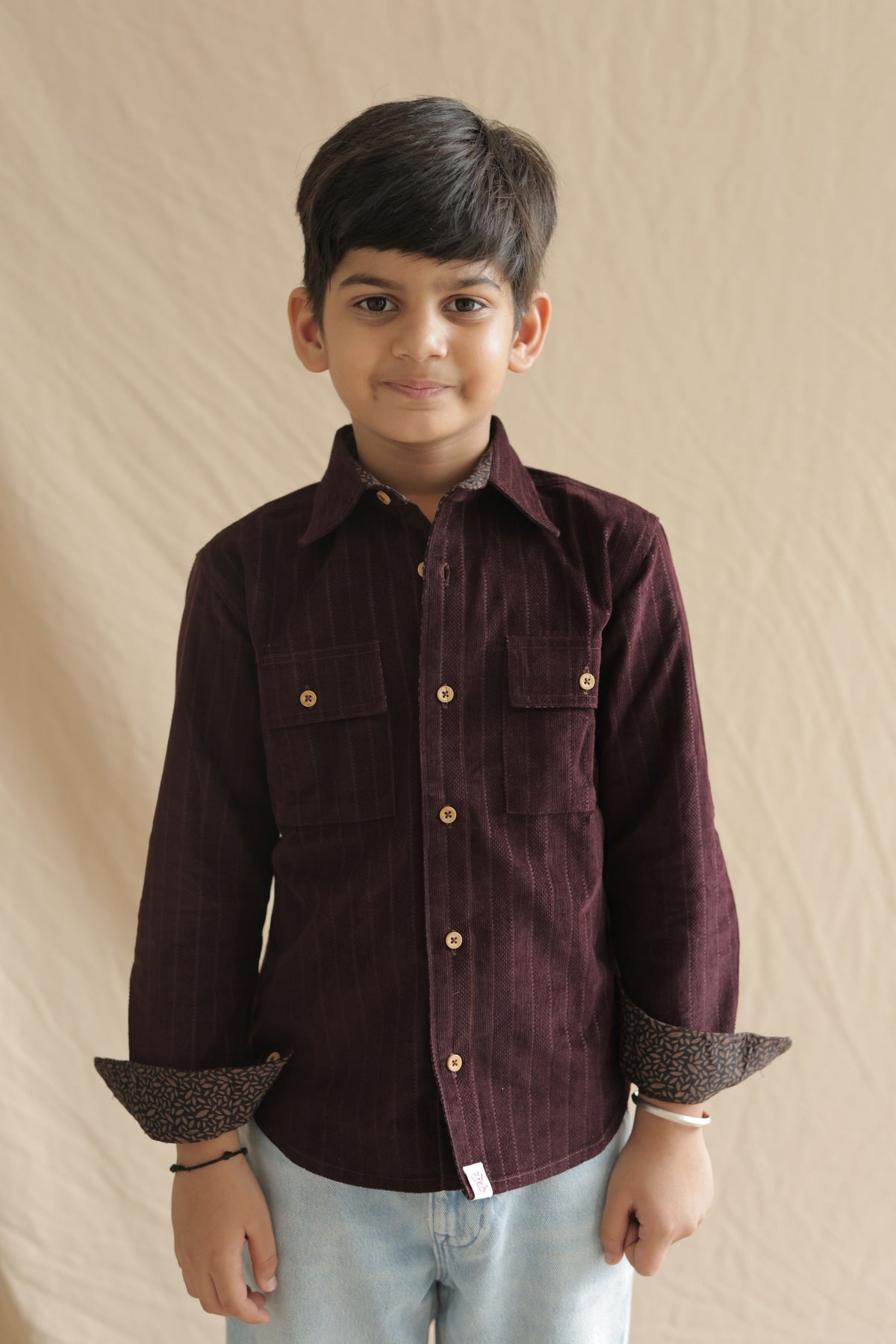 Boys burgundy corduroy button-up with patterned elbow patches and two front chest pockets