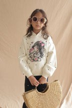 Off-white girls' hoodie with teddy hug heart graphic, front view