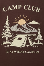 Brown kids' T-shirt graphic close-up: “CAMP CLUB” with tent, trees, and sun