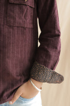 Burgundy corduroy shirt sleeve with contrast patterned cuff and elbow patch