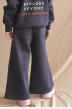 Navy fleece palazzo pants with elastic waist, wide-leg drape and side pockets