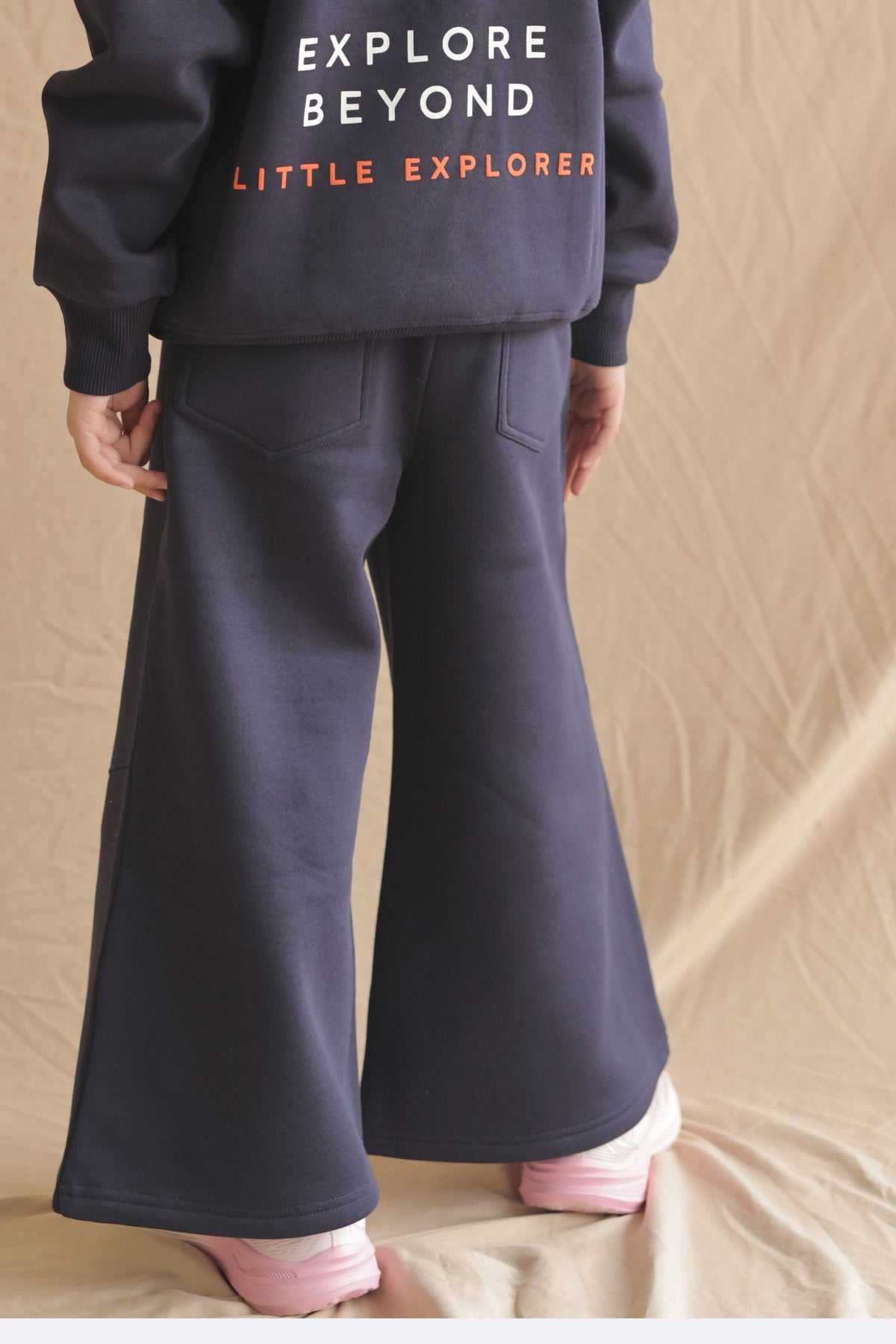 Navy fleece palazzo pants with elastic waist, wide-leg drape and side pockets