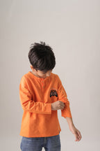 Boys orange henley T-shirt with off-road car embroidery on chest, long sleeves