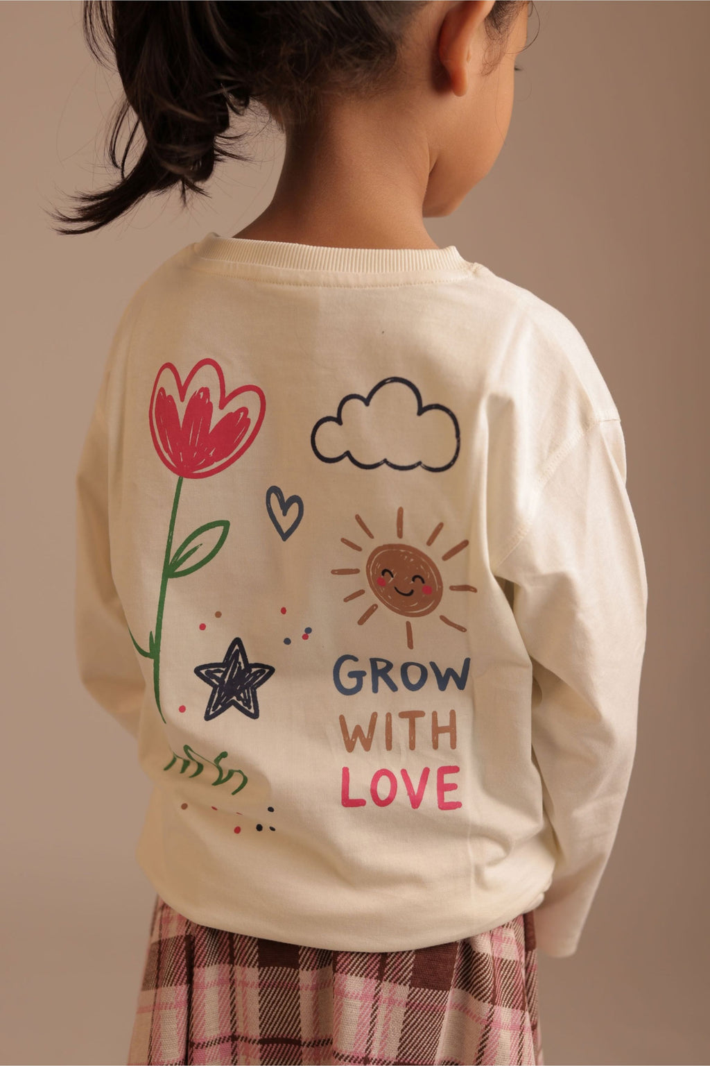 Off-white long-sleeve tee with back “Grow with Love” heart sun star floral graphic