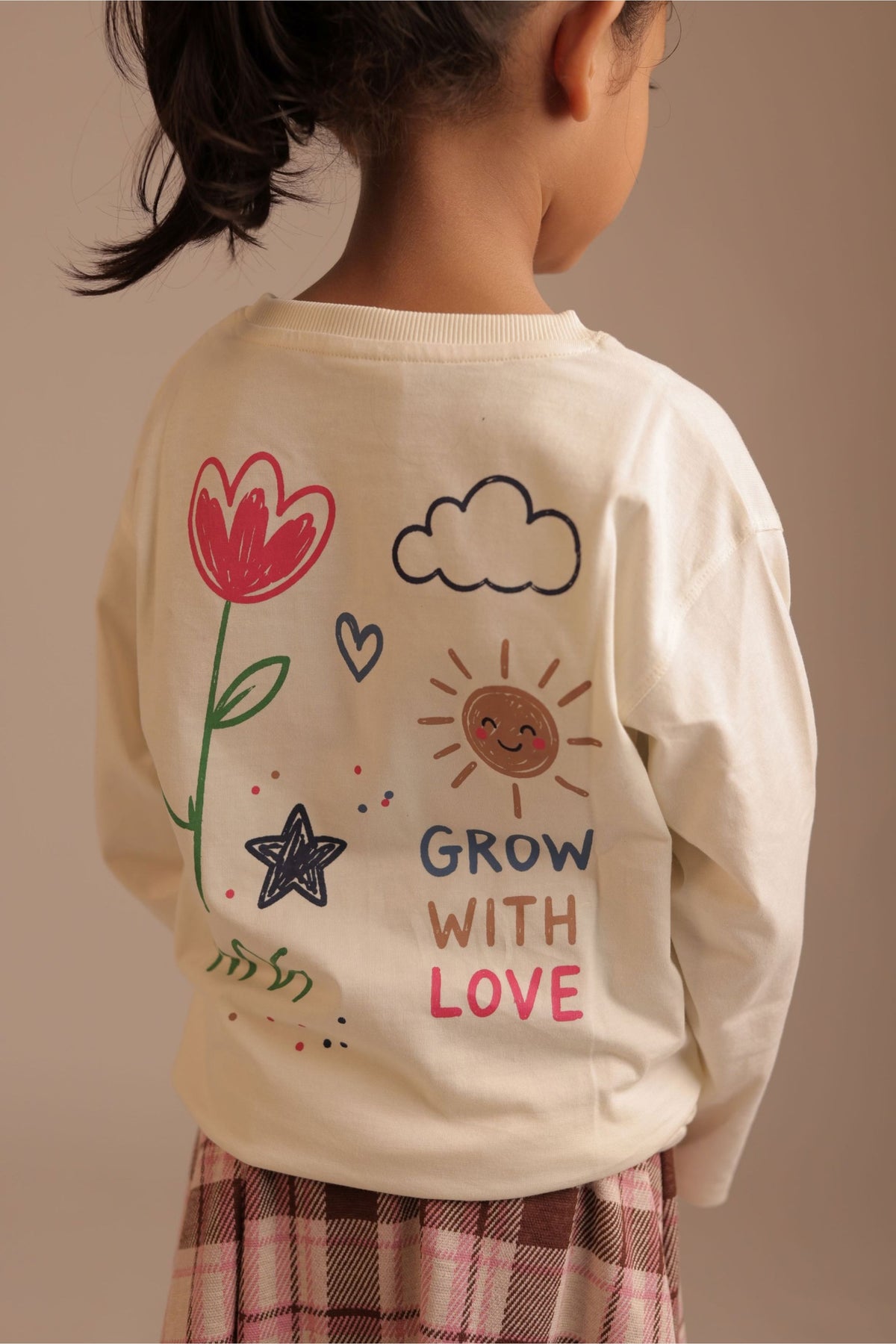 Off-white long-sleeve tee with back “Grow with Love” heart sun star floral graphic