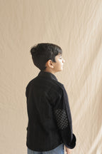 Black corduroy shirt with printed elbow patch and button front