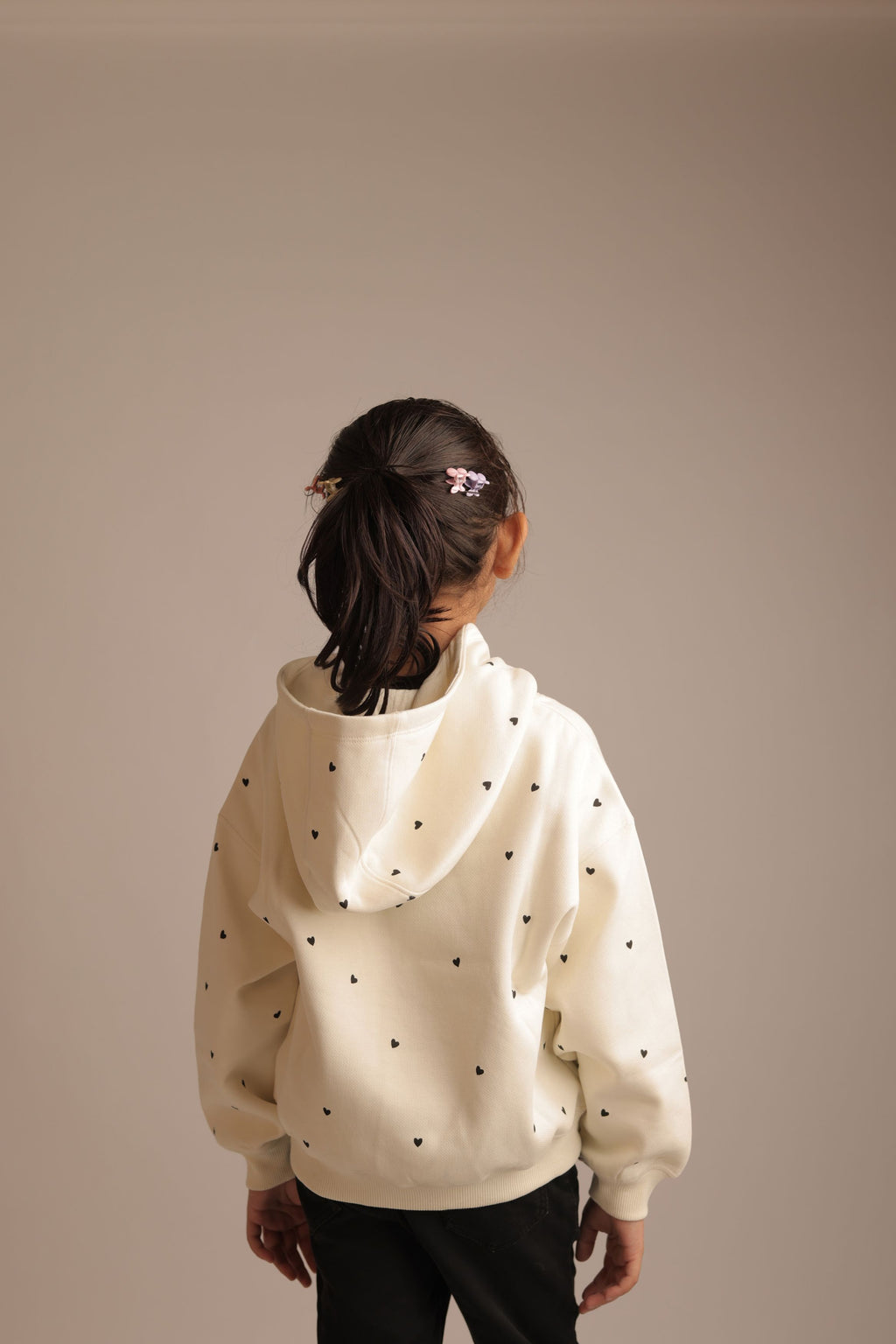 Off-white girls' hoodie with small heart print all over, back view