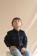 Boys navy corduroy long-sleeve button-up shirt with gold buttons and flap pockets