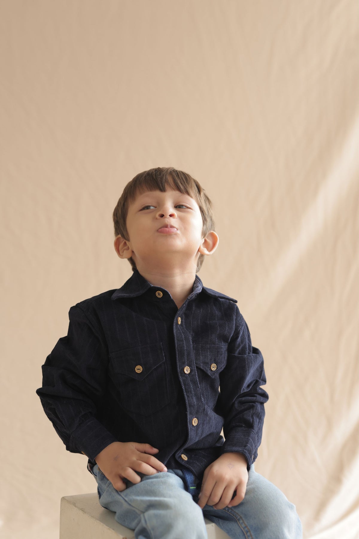 Boys navy corduroy long-sleeve button-up shirt with gold buttons and flap pockets