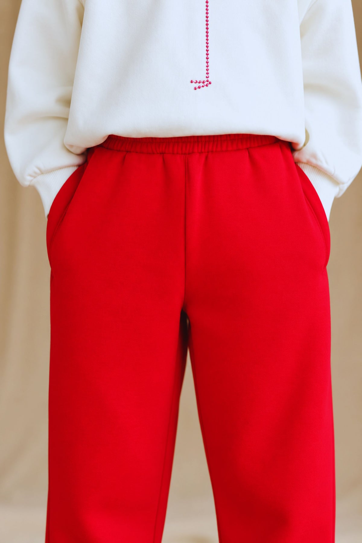 Red 320 gsm fleece palazzo pants with elastic waistband and wide straight legs