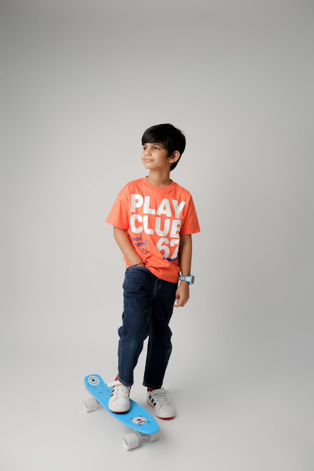 Coral graphic tee worn with "PLAY CLUB 67" print