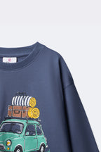 Dusty blue long-sleeve tee with partial Little Road Stories bus print