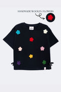 Black boxy comfort tee with colorful crochet flower appliques and side bow ties