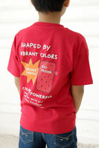 Red T-shirt worn by child, back print 'Shaped by Vibrant Colors'