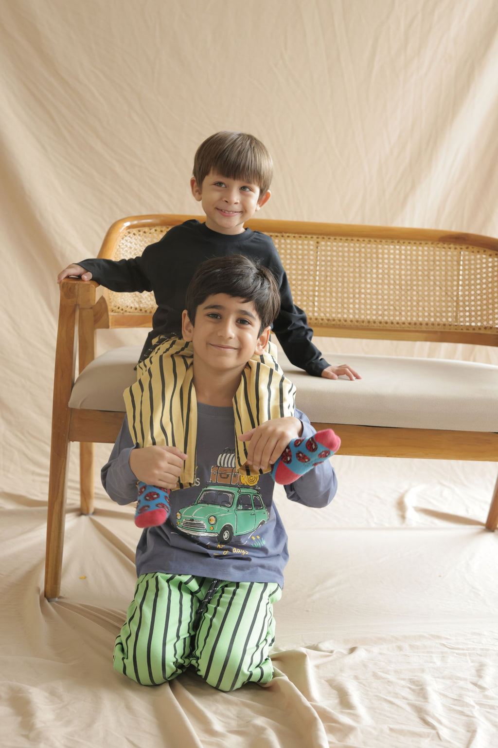 Sand and black vertical striped kids track pants with elastic waist and pockets