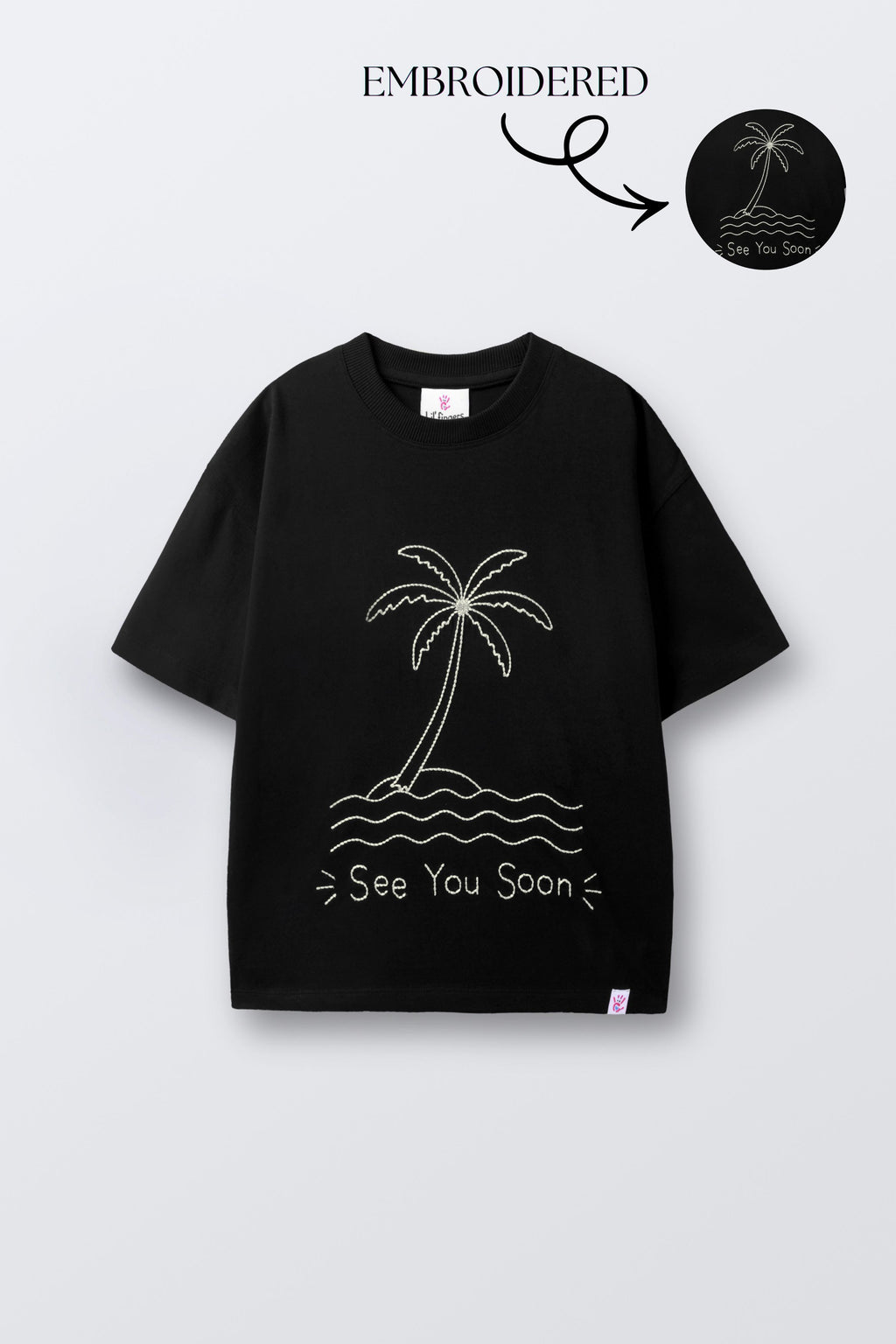 Black oversized t-shirt with embroidered palm tree, waves, and 'See You Soon' text